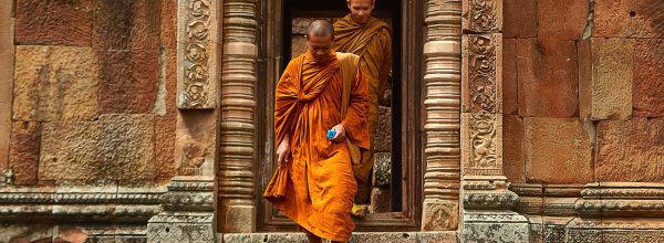 Two Monk in Orange Robe Walking Down the Concrete Stairs